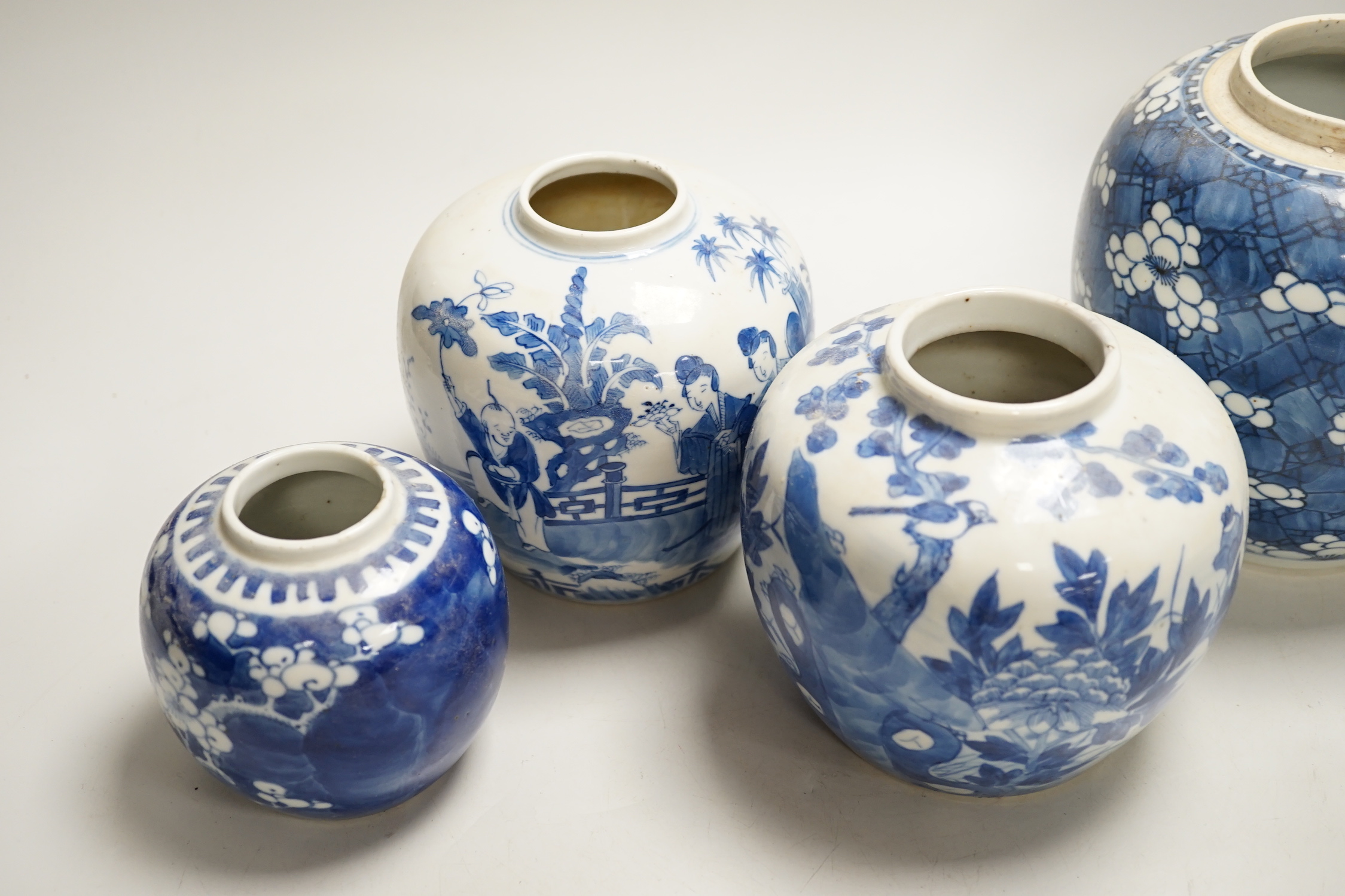 An 18th century Chinese blue and white Prunus jar and three 19th century Chinese blue and white jars, tallest 16cm